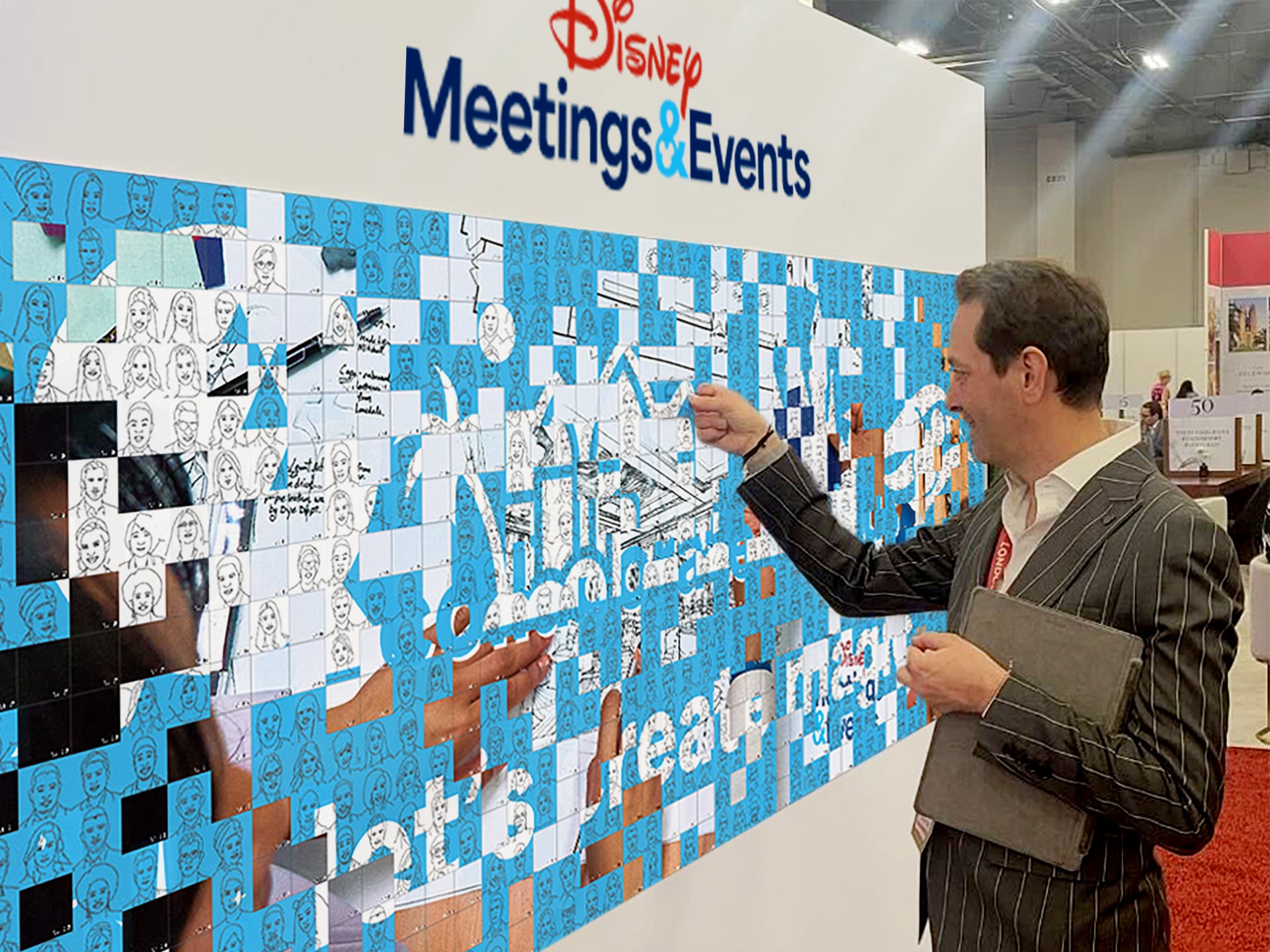 Man placing an adhesive portrait onto a Live Sketch Mosaic wall for Disney Meetings & Events